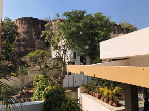 a view from a building with a mountain in the background at Kalpana Yoga Homestay in Jaipur