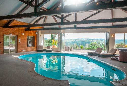 a swimming pool in a house with a view at Clydey Cottages Pembrokeshire in Pembrokeshire