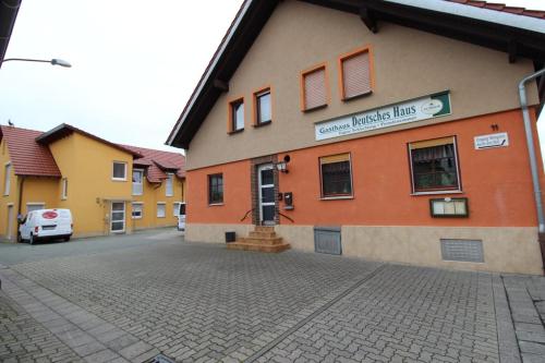 a building with a street in front of it at Gasthaus Deutsches Haus in Schifferstadt