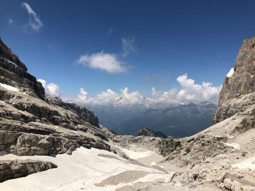a view of a snowy mountain with mountains in the background at La Casa di Olivo in Tassullo