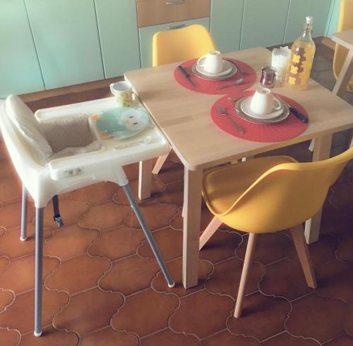 a table with two chairs and a table and a table and chairs at Villa Sofia in Pramaggiore