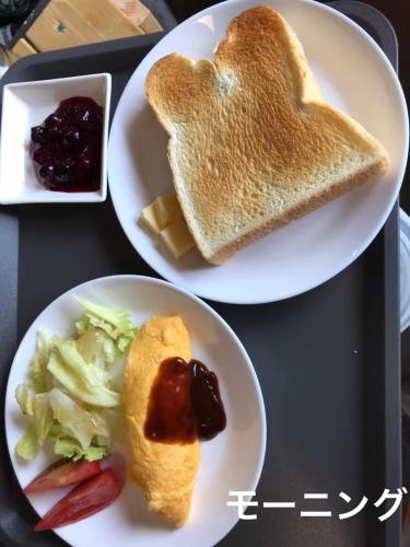 two plates with toast in the shape of a heart at MARINE-Q in Inami