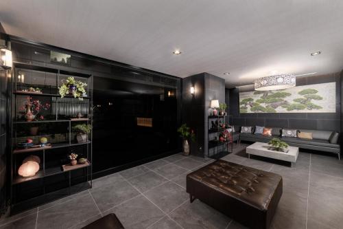 a living room with a couch and a table at MIMARU Tokyo Ginza East in Tokyo