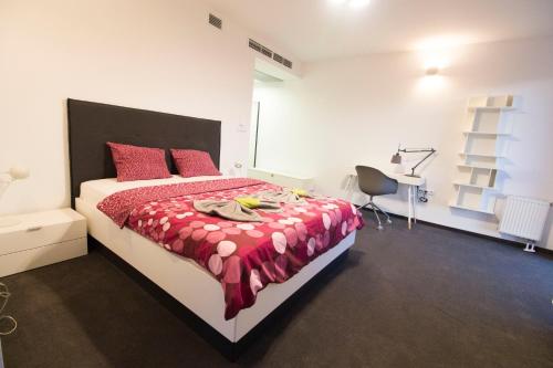 a bedroom with a bed and a dresser at LUCKY APARTMENTS - Wita Stwosza 15 Old Town in Wrocław