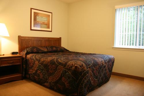 En eller flere senge i et værelse på Affordable Suites Florence