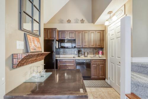 a kitchen with wooden cabinets and a counter top at Condo 616 at North Creek Resort in Blue Mountains