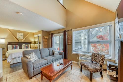 a living room with a couch and a bed at Condo 616 at North Creek Resort in Blue Mountains