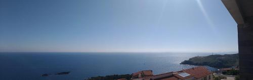 a view of the ocean from a building at Villa Luxe Vue Panoramique sur la mer piscine clim cassee 4 etoiles meuble tourisme in Cerbère