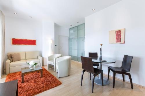 a living room with a couch and a table at Hotel Villa Annette in Rabac