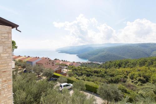 a view of a lake from a house at Hotel Villa Annette in Rabac