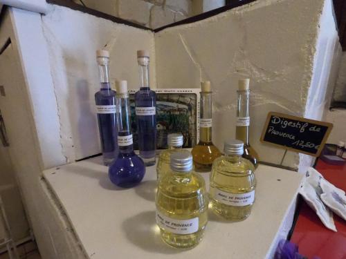 a box with four bottles of essential oils on a counter at Le palais, hôtel - restaurant in Apt