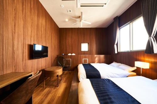 Postel nebo postele na pokoji v ubytování &AND HOSTEL SHINSAIBASHI EAST