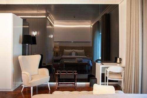 a hotel room with a bedroom with a bed at Casa das Carpas in Vizela