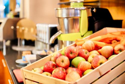 a box of apples and french fries on a counter at Grand Hotel Beau Rivage Interlaken in Interlaken