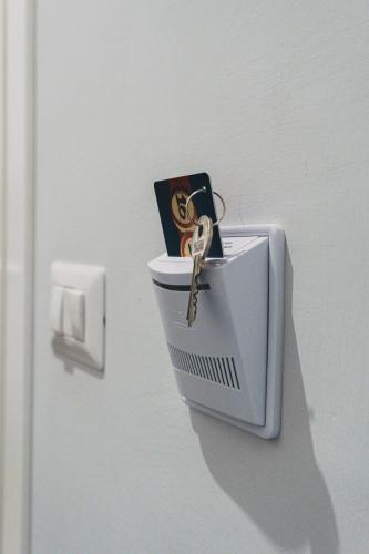a key to a toilet with a book on it at Terno su Napoli in Naples