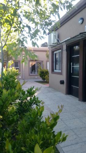 a house with a driveway in front of a house at Las Casuarinas in Pilar
