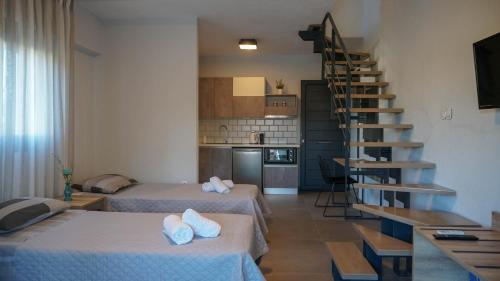 Ένα ή περισσότερα κρεβάτια σε δωμάτιο στο Enalia Luxury Living