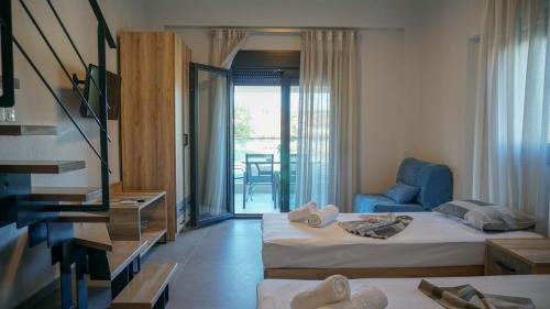 Ένα ή περισσότερα κρεβάτια σε δωμάτιο στο Enalia Luxury Living