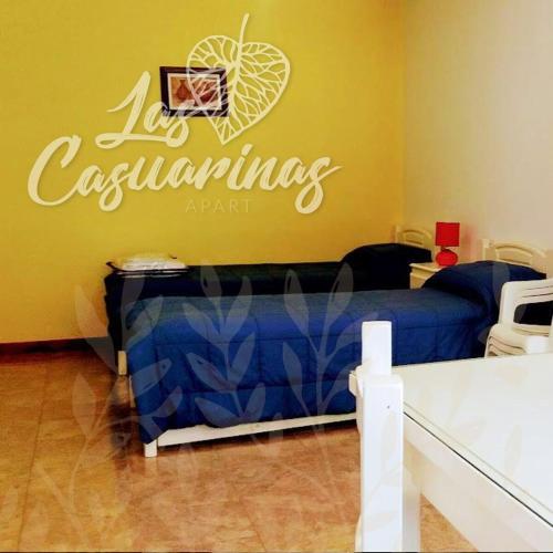 a room with a bed with a basketball sign on the wall at Las Casuarinas in Pilar