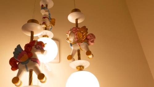 a group of toy animals hanging from a ceiling at Red Letter Day in Tainan