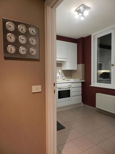 a kitchen with plates hanging on the wall at Apartment Het Blekershuys in Bruges