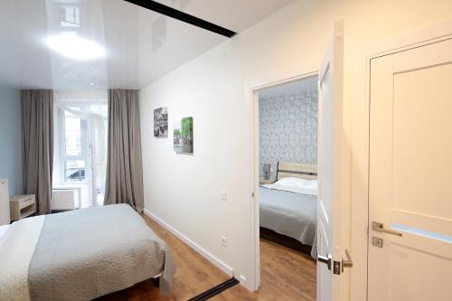 En eller flere senge i et værelse på Lviv center VIP apartments new building