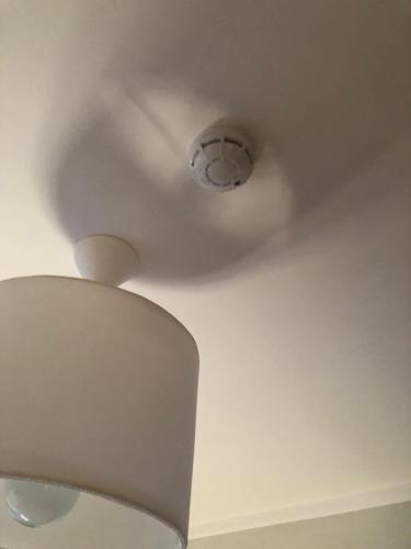 a ceiling with a light in a room at Aparthotel Room 107 at Orbi Palace in Bakuriani in Bakuriani