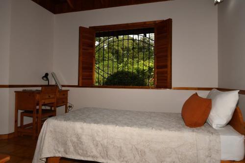 Tempat tidur dalam kamar di Hacienda Baru