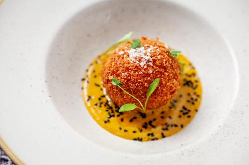 a white plate with a dessert on top of it at The Seaview Hotel And Restaurant in Seaview