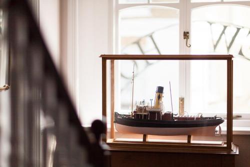 a model boat in a glass case in a window at The Seaview Hotel And Restaurant in Seaview