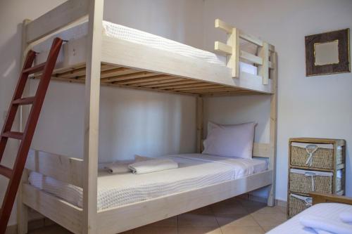 Postel nebo postele na pokoji v ubytování Koilon Apartments