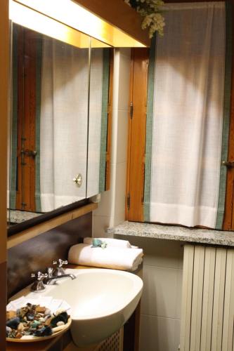 a bathroom with a sink and a mirror at Aethalia Bed and Breakfast in Portoferraio