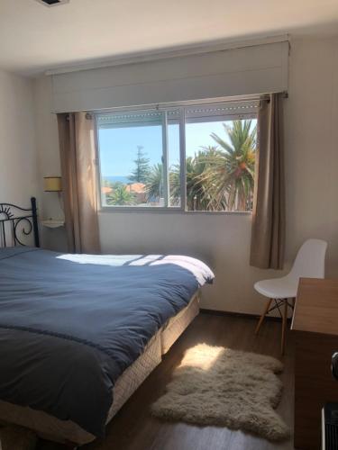 Tempat tidur dalam kamar di Apartamento 4 Mares - El Faro