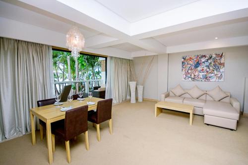 
a living room filled with furniture and a large window at Villa Caemilla Beach Boutique Hotel in Boracay
