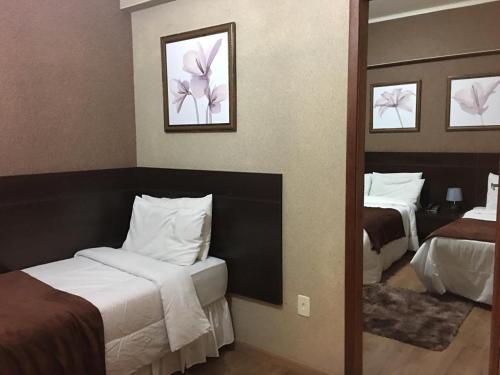 Ein Bett oder Betten in einem Zimmer der Unterkunft Hanna Palace Hotel