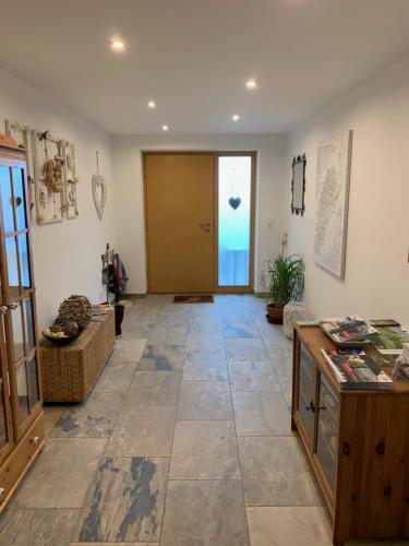 a hallway with a door and a tile floor at Alpfee Lechtal in Bach