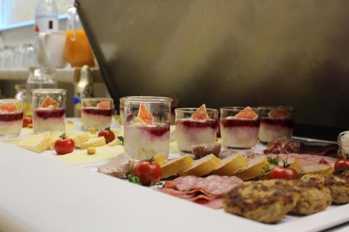 a table with many different types of food on it at Pension Haus Lassen in Westerland (Sylt)