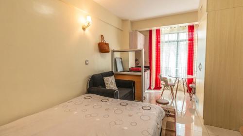 Llit o llits en una habitació de Ruthys Apartment
