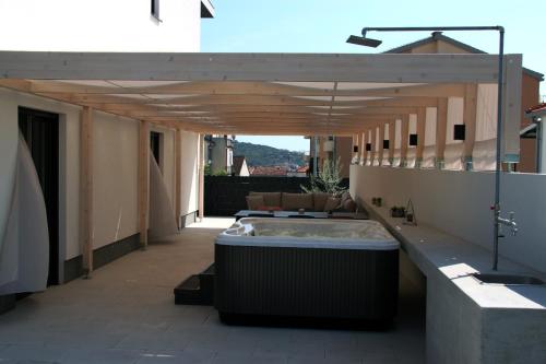 a hot tub on the roof of a building at Apartment KATE in Trogir