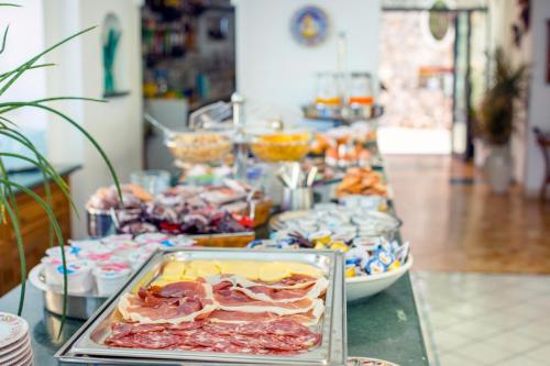 a buffet of food on a table in a store at Hotel Smeraldo in Praiano