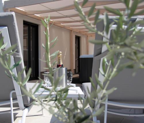 a bottle of champagne sitting on a table in an office at Apartment KATE in Trogir