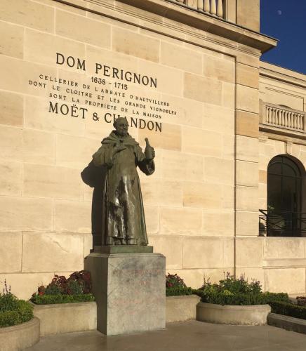 a statue of a man in front of a building at Luxurious Townhouse 10 mins walk to Epernay centre in Épernay