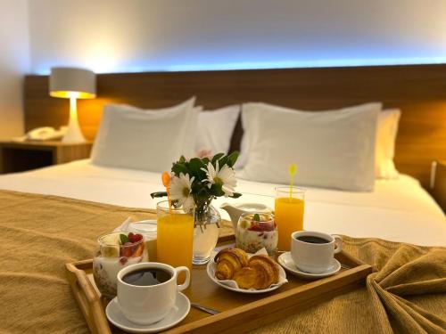 Ένα ή περισσότερα κρεβάτια σε δωμάτιο στο Parque Hotel Jean Clevers