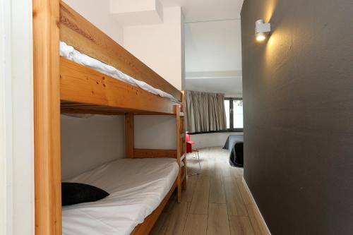 Postel nebo postele na pokoji v ubytování Hotel De Loft