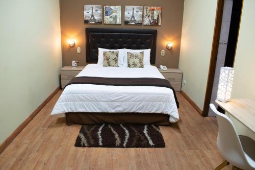 En eller flere senge i et værelse på Hotel Inka Path