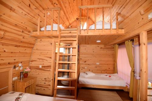 Llit o llits en una habitació de Otantik Tas Ev