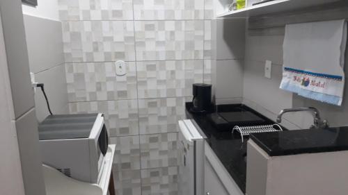 a small bathroom with a sink and a toilet at Praia II de Copacabana in Rio de Janeiro