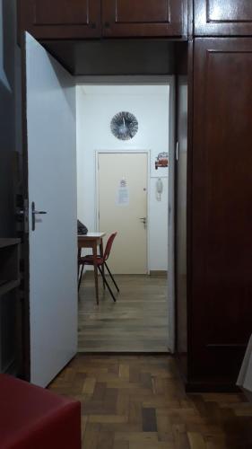 a door leading into a room with a table at Praia II de Copacabana in Rio de Janeiro