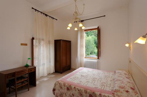Tempat tidur dalam kamar di Hotel San Sebastiano