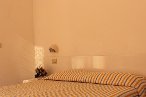 Säng eller sängar i ett rum på Residence Azzurro